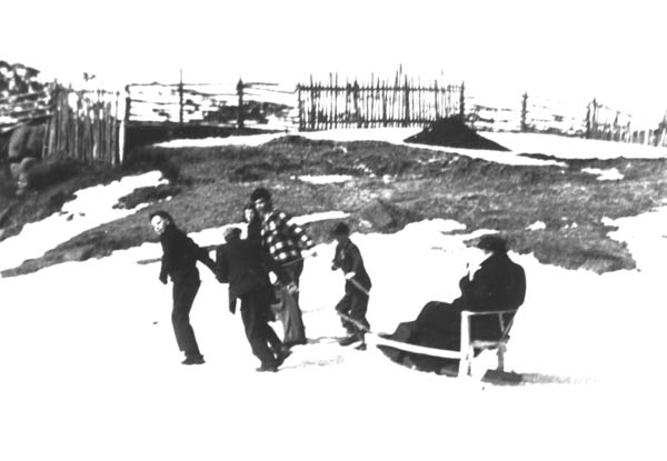 385: Five boys pulling Fr. Fyme in a sled. [courtesy of Mary (Dunphy) Lamb]